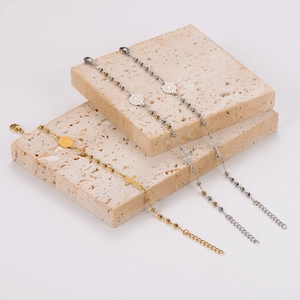 Minimalist stainless steel beaded bracelet with cross and icon pendants on stone decor