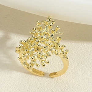 Macro shot of 14K gold plated coral branch ring with spherical beads and open band