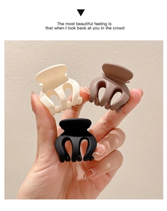 Mini matte shark hair clips in cream, brown, and black colors for ponytail styling