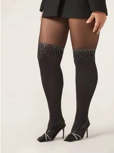 Detail of faux over-the-knee tights with gradient rhinestones and black high heel sandals