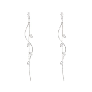 Detailed macro view of long silver tassel earrings with sparkling white cubic zirconia stones