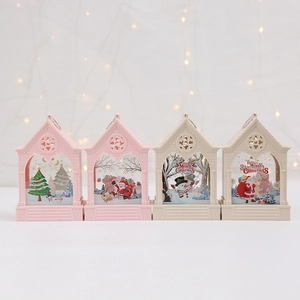 Macro detail of four LED Christmas house lanterns with vintage festive illustrations