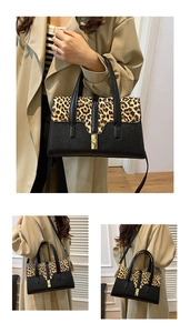 Detail of the leopard print flap and gold lock on this retro leather shoulder bag