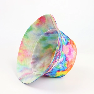 Detailed close-up showing the vibrant tie-dye pattern and stitching on a reversible bucket hat