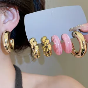 6-pair set of acrylic and twisted metal hoop earrings in gold and pink marble style