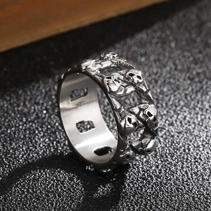 Macro view of gothic hollow skull ring with vintage silver finish and dual-row skeleton detail
