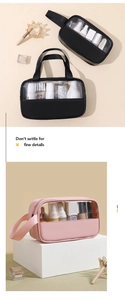 Detail view of pink and black PVC makeup bags with PU leather handles for travel