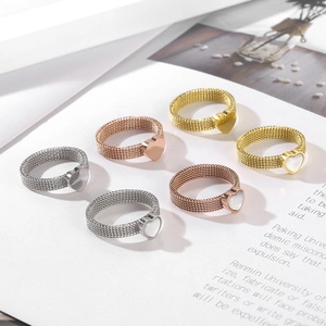 Mesh woven heart rings in gold, rose gold, and silver finishes with shell inlay details