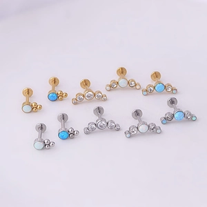 Detailed cluster of opal and zircon flat back labret studs in gold and silver finish