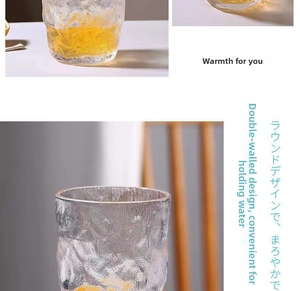 Detail of round glacier textured heat-resistant glass cup with ice and lemon slices