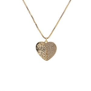 Detailed close-up of heart pendant featuring half-pave rhinestones and hammered metal finish