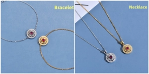 Detail of 18K gold and silver plated necklaces and bracelets with ruby red center stones