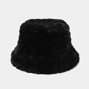 Detailed view of black plush bucket hat with textured faux fur for winter warmth