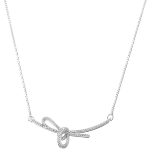 Macro view of silver ribbon bow pendant with micro-pave cubic zirconia on box chain
