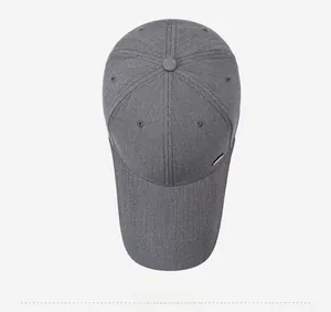 Overhead view of grey baseball cap with fine texture and silver metal detail