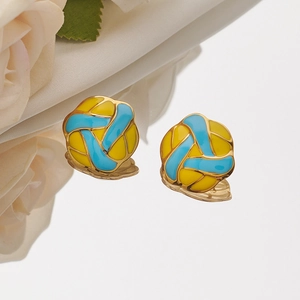 Elegant gold-plated volleyball stud earrings with blue and yellow enamel on white rose