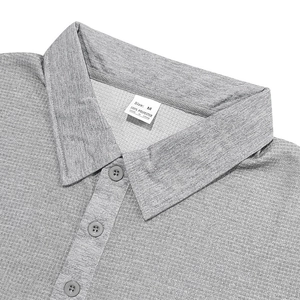 Macro shot of grey waffle polo shirt collar and buttons with size M polyester label