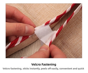 Detail of red and white striped Christmas tree skirt with convenient velcro closure