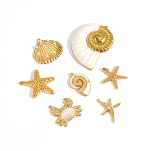 7-piece gold ocean charms set featuring starfish and shell pendants on white background