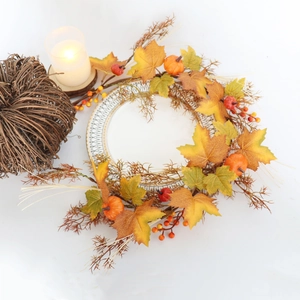 Detail of 40cm autumn wreath with pumpkins and maple leaves on a white background