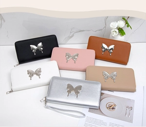 Collection of women's long zipper wallets with metal butterfly decor in various colors