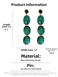 Macro detail of emerald green geometric drop earrings with 9.1cm length and 1.7cm width