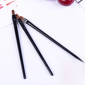Three-piece detail makeup brush set with black glossy handles and synthetic brown bristles