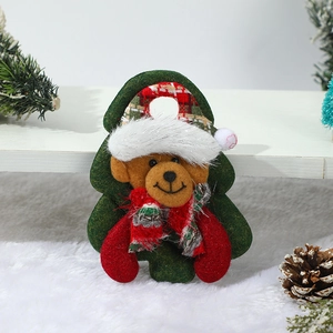 Detail of a Christmas plush bear ornament with green tree felt and plaid scarf