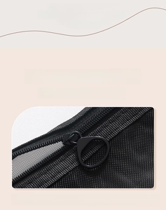 Detail of nylon mesh makeup bag featuring a smooth metal ring zipper puller design