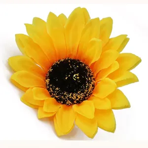Realistic artificial sunflower hair clip with vibrant yellow petals for seaside vacation