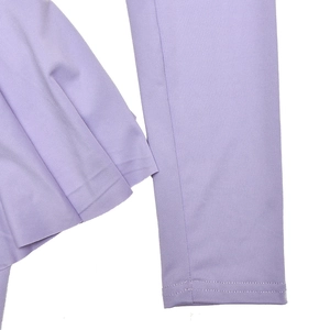 Close-up of purple dress sleeve and ruffle detail with premium stitching texture