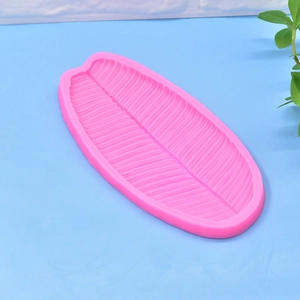 Pink silicone banana leaf mold for fondant or soap making with detailed vein texture