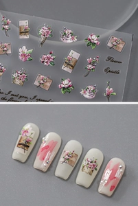 Detail showing vintage floral and epistle nail stickers on creamy white manicured nails