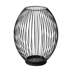 Modern black geometric wire candle holder and metal hollow decorative vase on white background