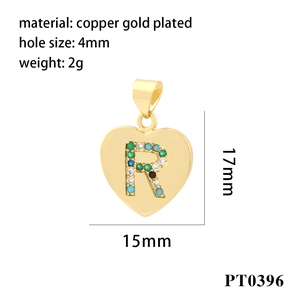 Detail of 18K gold-plated heart pendant with letter R and colorful cubic zirconia