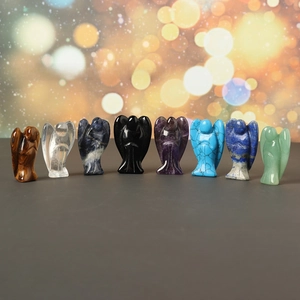 Set of eight 1.5 inch carved crystal angel figurines in various natural gemstones