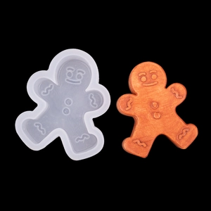 Gingerbread man silicone mold for Christmas candles and baking with a finished resin craft
