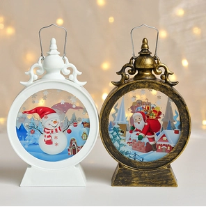 Detail of Christmas lantern with Santa and snowman illustrations in warm bokeh lighting