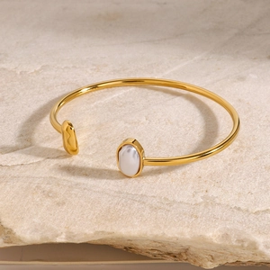 Minimalist gold plated stainless steel open bangle with elegant white pearl accents