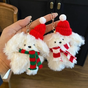 Handheld plush bunny keychain with red Christmas hat and striped scarf detail