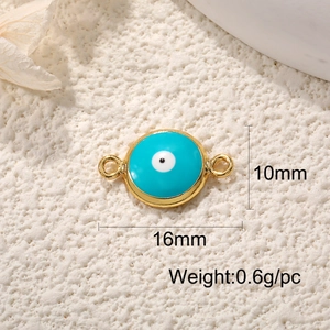 Macro detail of 16mm x 10mm blue Evil Eye pendant with gold plating and weight scale