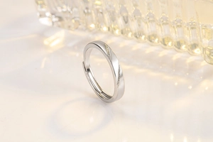 Macro shot of adjustable silver ring with twisted band and delicate bead detailing