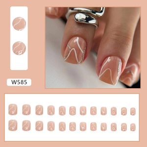 Short nude pink press-on nails with white wavy lines and silver glitter accents