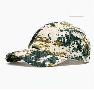 Close-up of woven camouflage green straw baseball cap showing breathable mesh texture