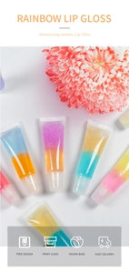Close-up of moisturizing rainbow lip gloss tubes with layered colors and vegan base