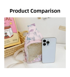 Pink kids crossbody bag with glitter sequins and size comparison to a smartphone