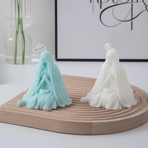 Artistic female figure scented candles in blue and white on a wooden tray decor