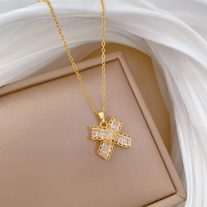 Luxurious gold titanium necklace with a crystal-encrusted butterfly T-shaped pendant