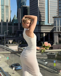 Slim fit white sleeveless dress with ruched slit detail and elegant high neck design