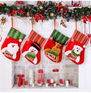 Detailed view of four Christmas stockings with 3D cartoon figures hanging on a fireplace